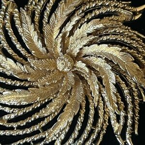 Vintage signed Monet gold tone floral sunburst brooch, excellent condition